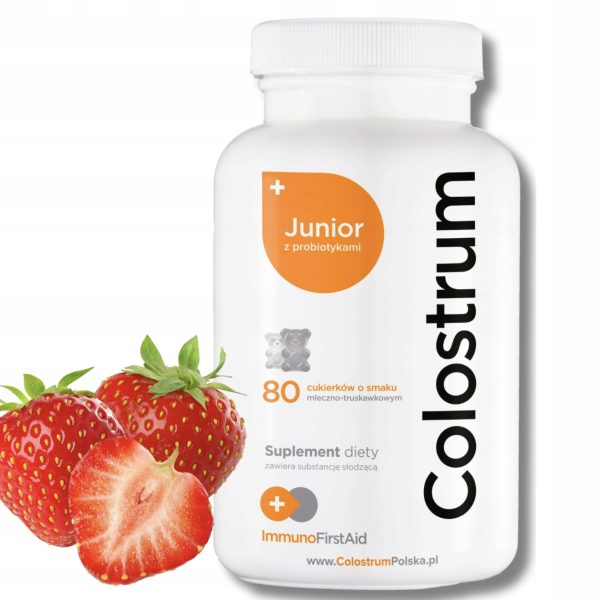 be6ce6a12b98a37391234f39c1001b44.jpg Słoik Colostrum Junior z 80 cukierkami do ssania dla dzieci, obok świeże truskawki